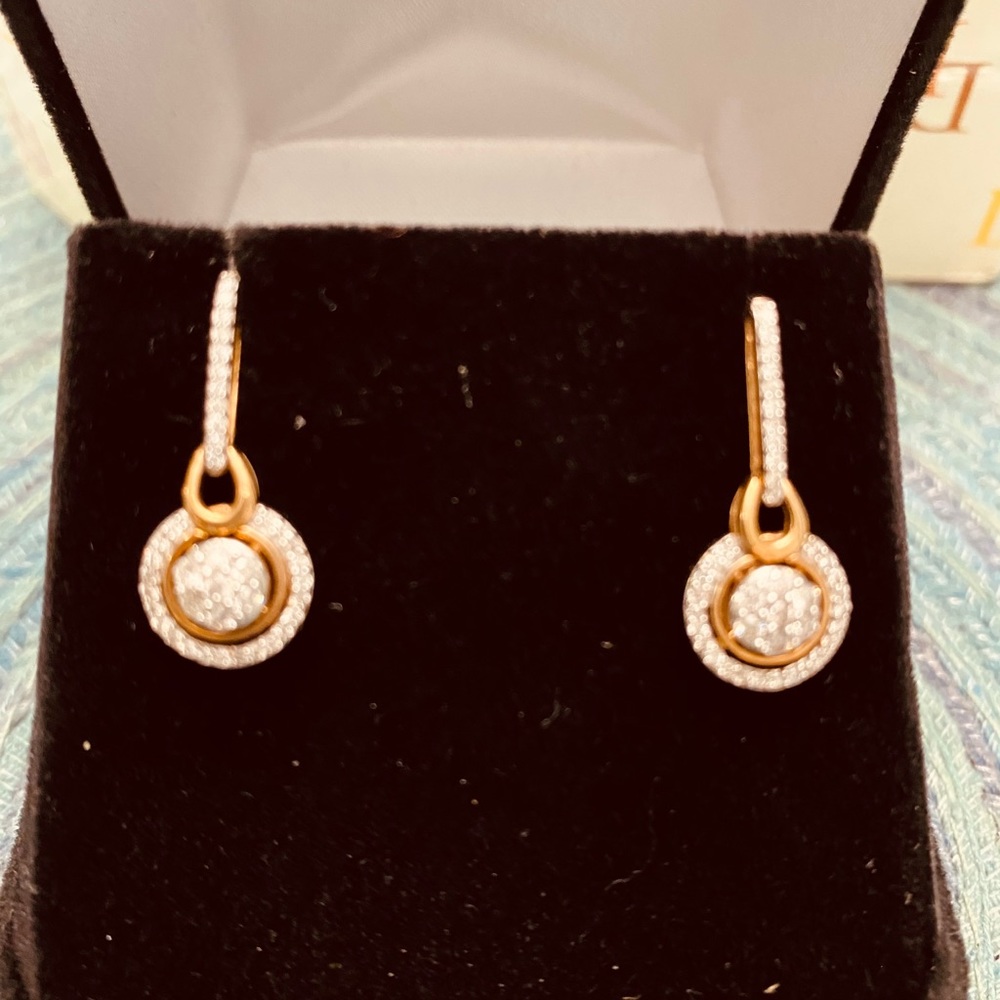 Dangling diamond earrings.